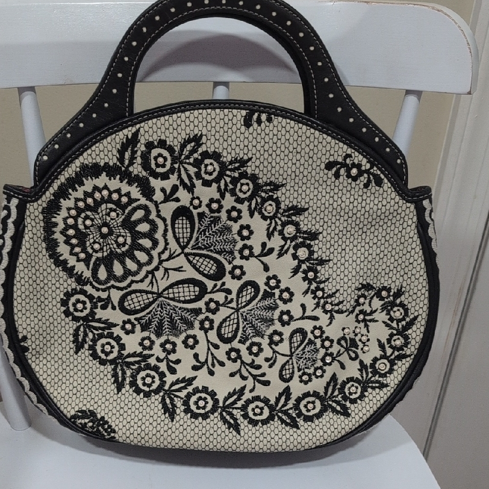 Elegant Black and Cream Floral Handbag